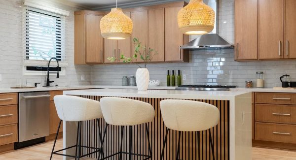 Modern kitchen with white oak cabinets and subway tile backsplash.