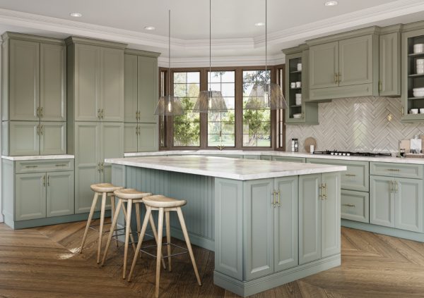 Sage green shaker cabinets with warm wood floors and a bank of windows in a classy kitchen with an island.