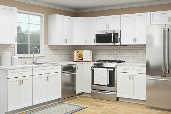Large, open eitchen with white cabinets and light wood floors with stainless appliances.